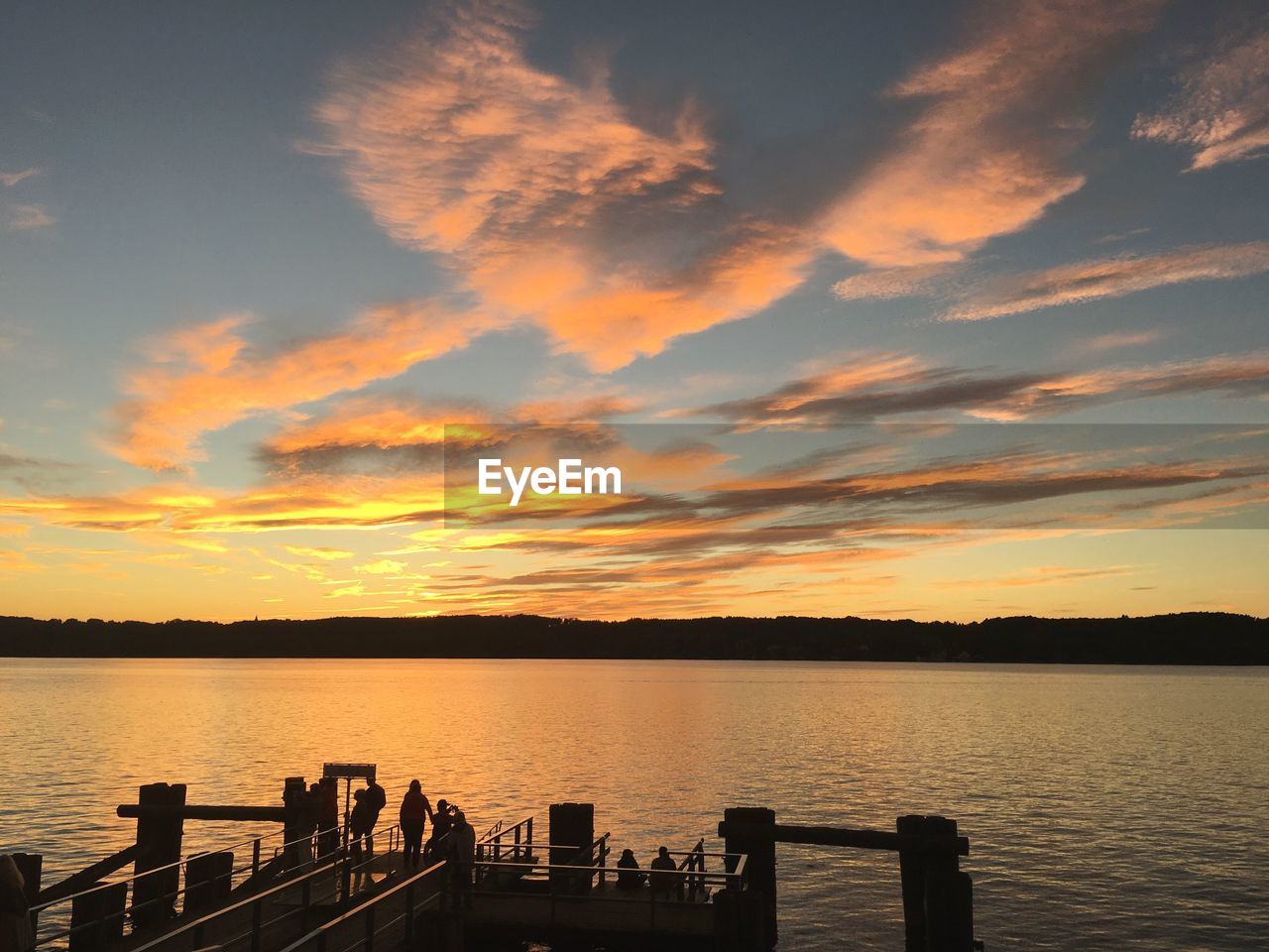 View of calm lake at sunset