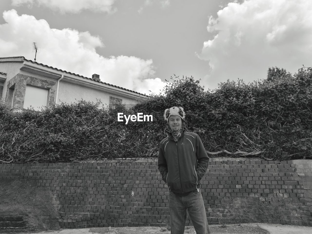 Portrait of man standing against sky