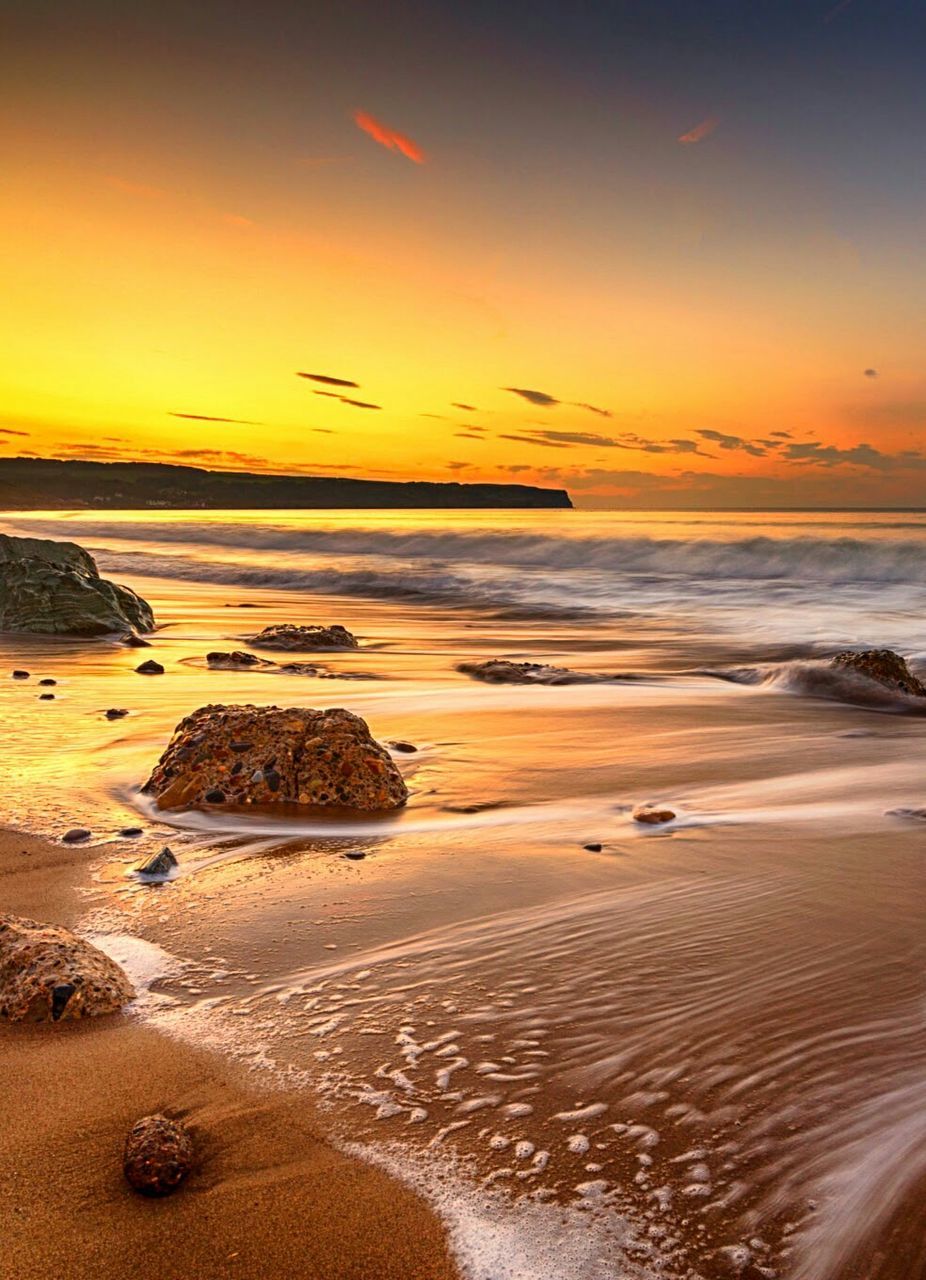 Scenic view of sea at sunset