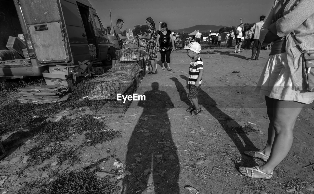 PEOPLE WALKING ON ROAD