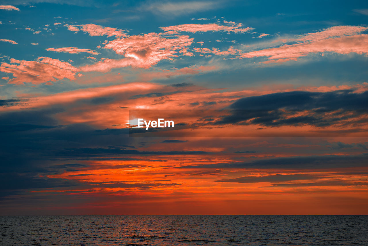 Dramatic sky over sea during sunset