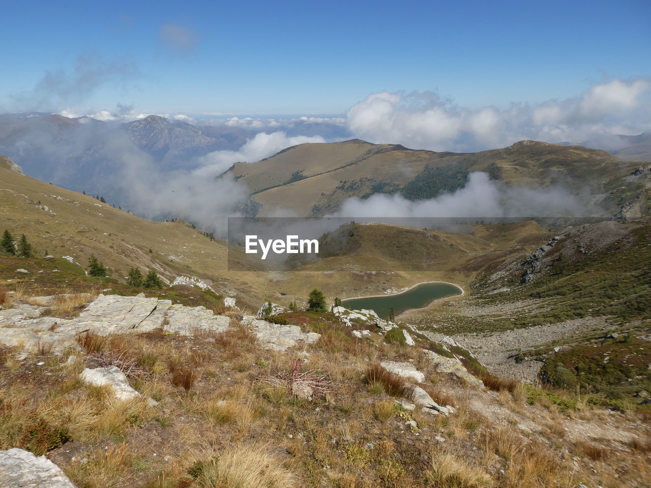 Scenic lake view with mountain panorama near colle sibolet