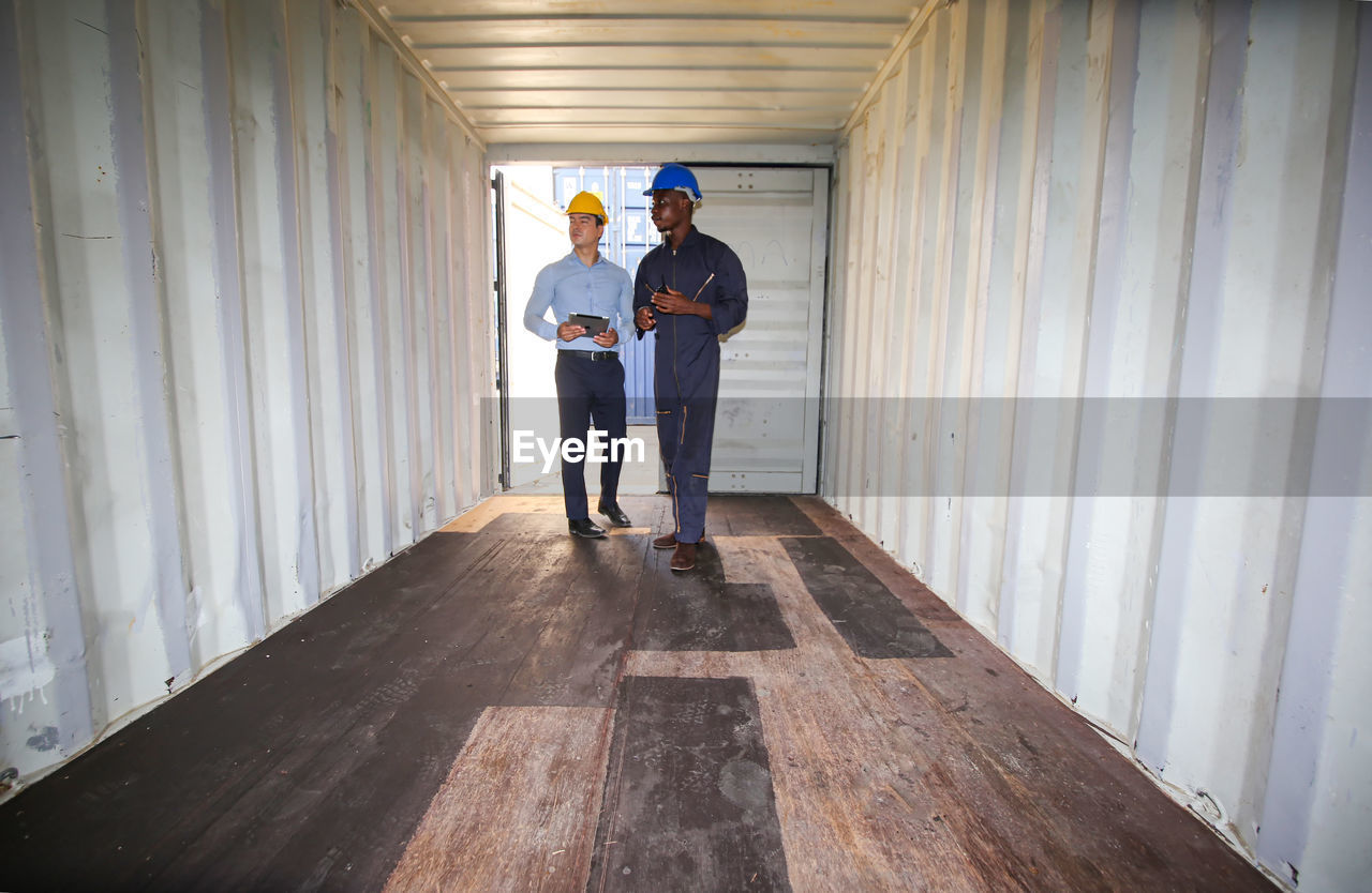 Man standing in container 