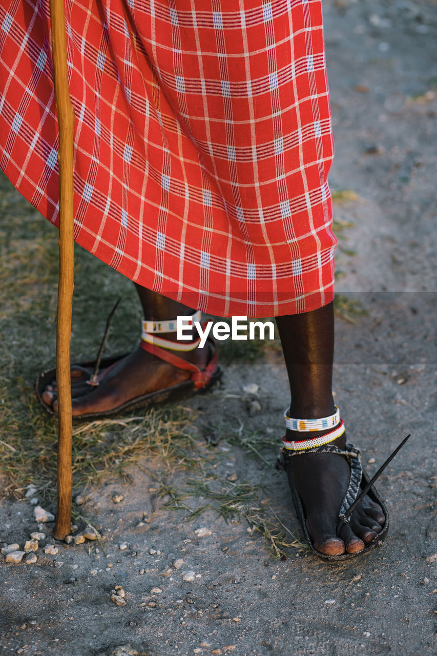 Close up of maasai warrior with a traditional sandals