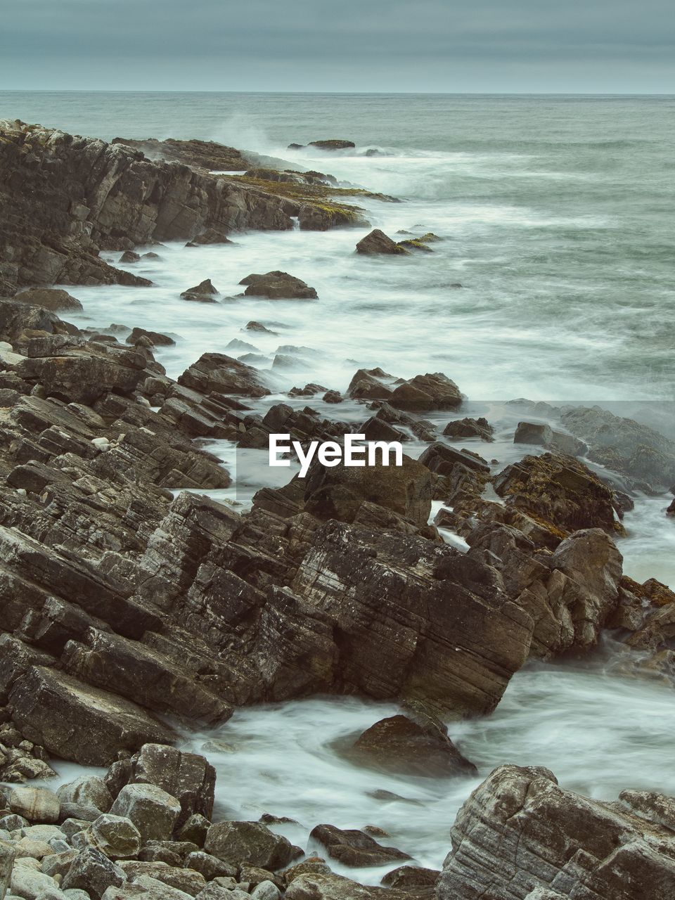 Long exposure waves on rocks at pescadero beach, california.