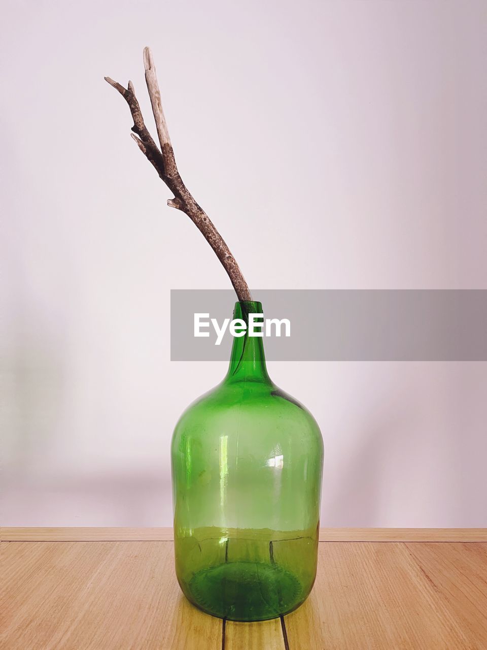 bottle, green, indoors, wood, no people, drink, plant, nature, food and drink, studio shot, still life, table, wine bottle, drinkware, food, lighting, container