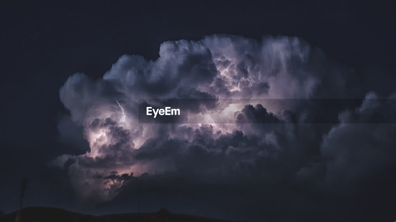 LOW ANGLE VIEW OF LIGHTNING IN SKY