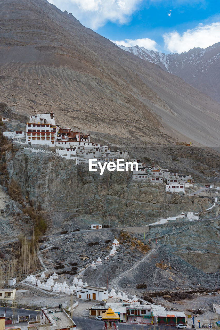 High angle view of buildings on mountain against sky