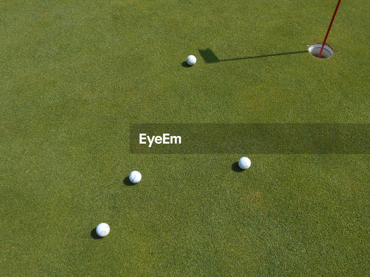 High angle view of balls on golf course