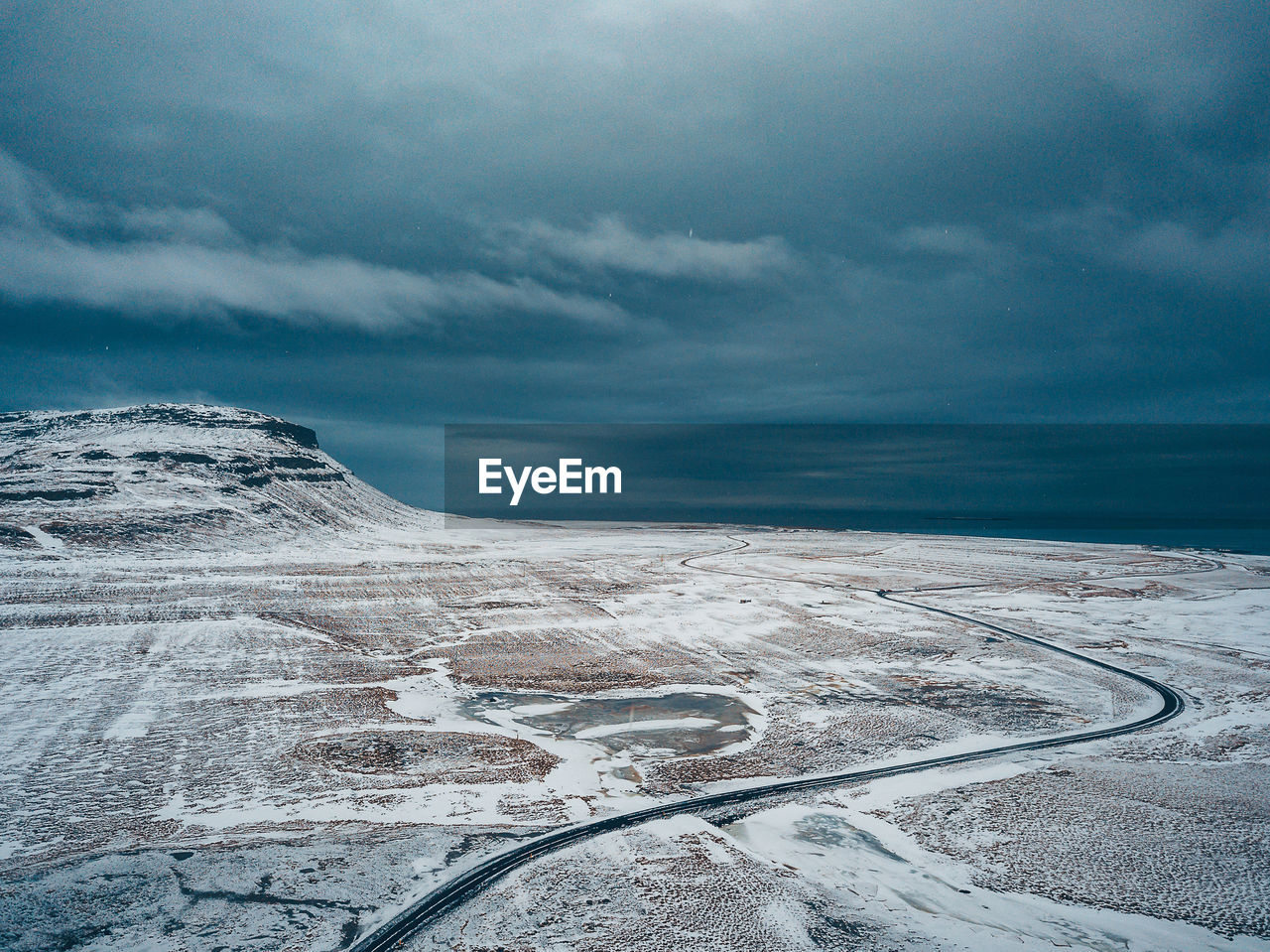 Scenic view of snowcapped landscape against sky