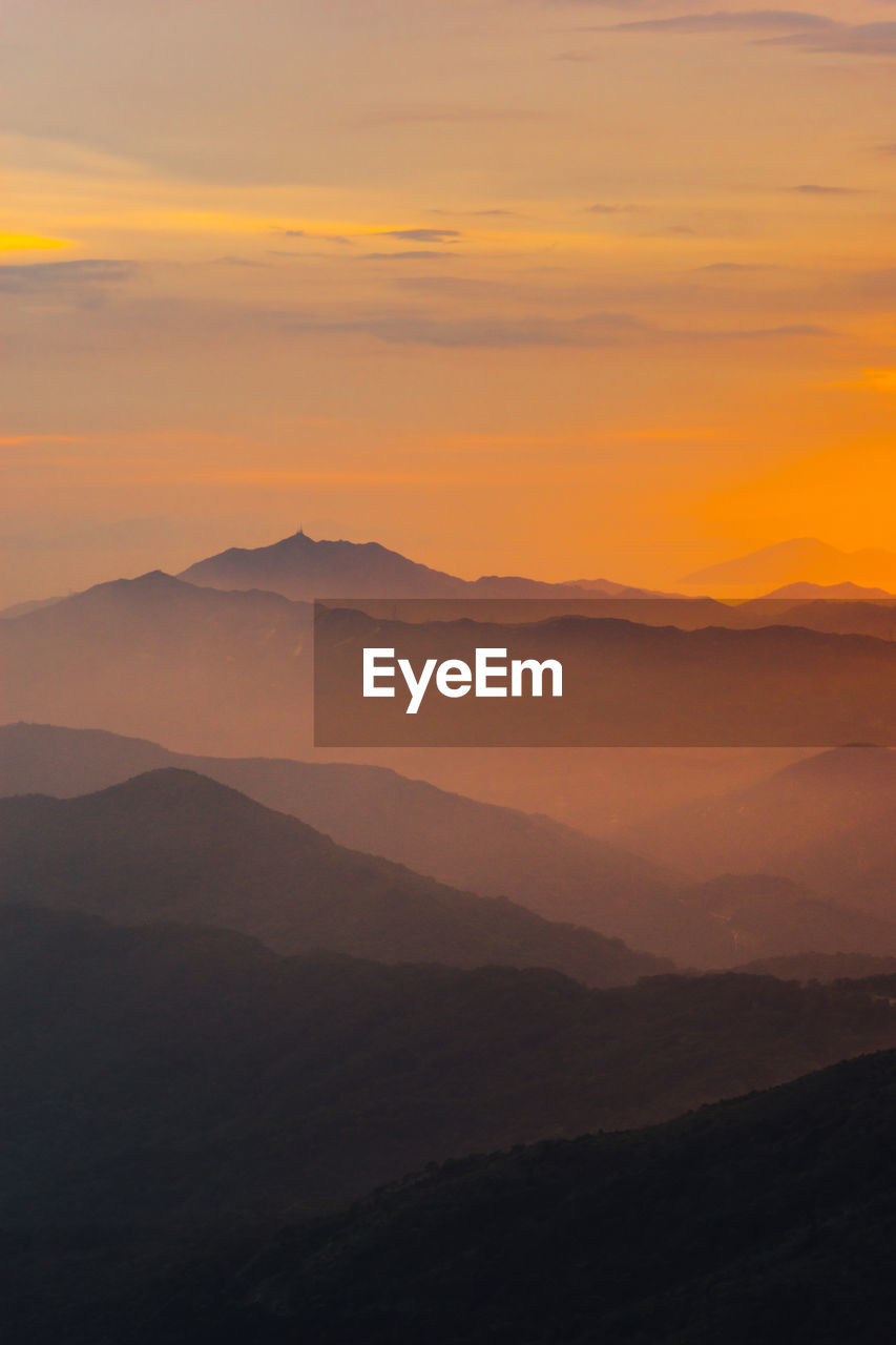 SCENIC VIEW OF SILHOUETTE MOUNTAIN AGAINST ROMANTIC SKY