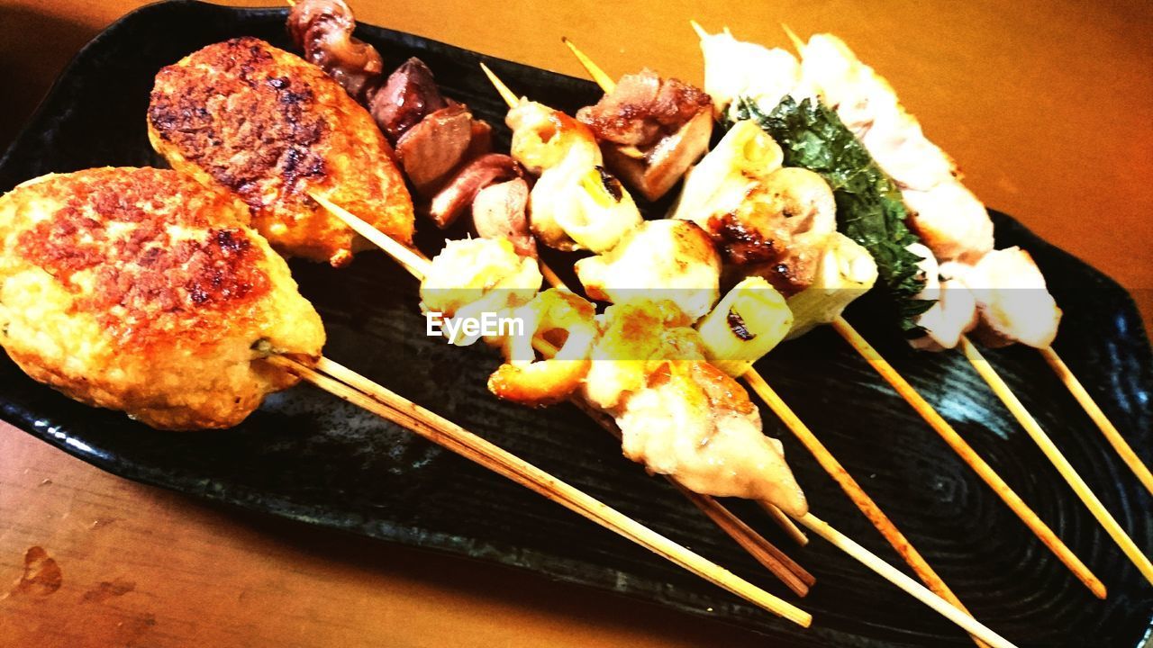 CLOSE-UP OF SERVED FOOD ON BARBECUE