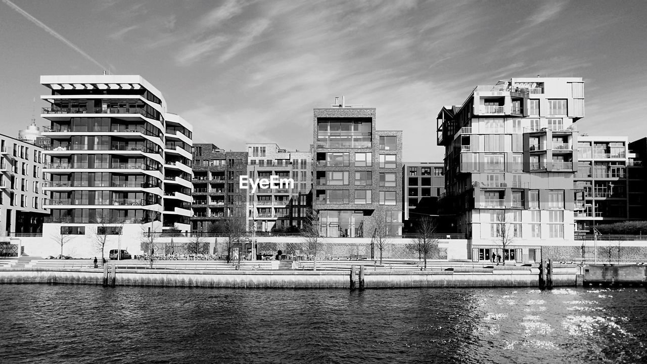 View of buildings and river in city