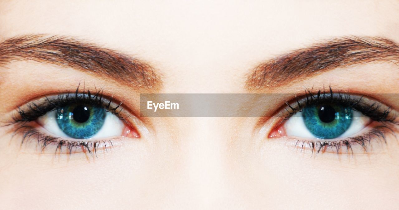 Extreme close up of woman with blue eyes