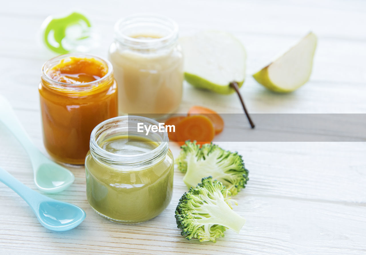 Baby food, assortment of fruit and vegetable puree, flat lay, top view, space for text