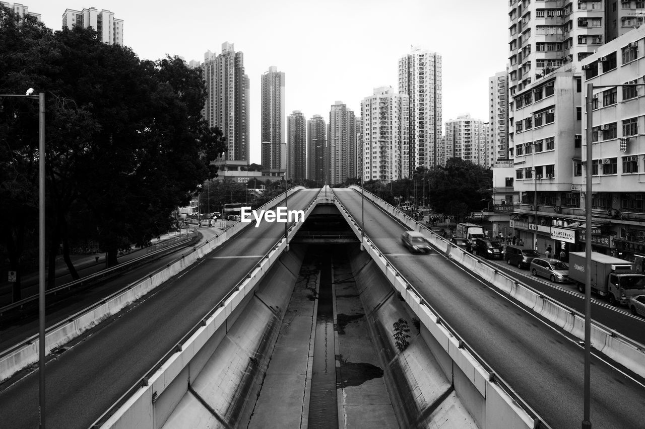 Bridge against buildings in city