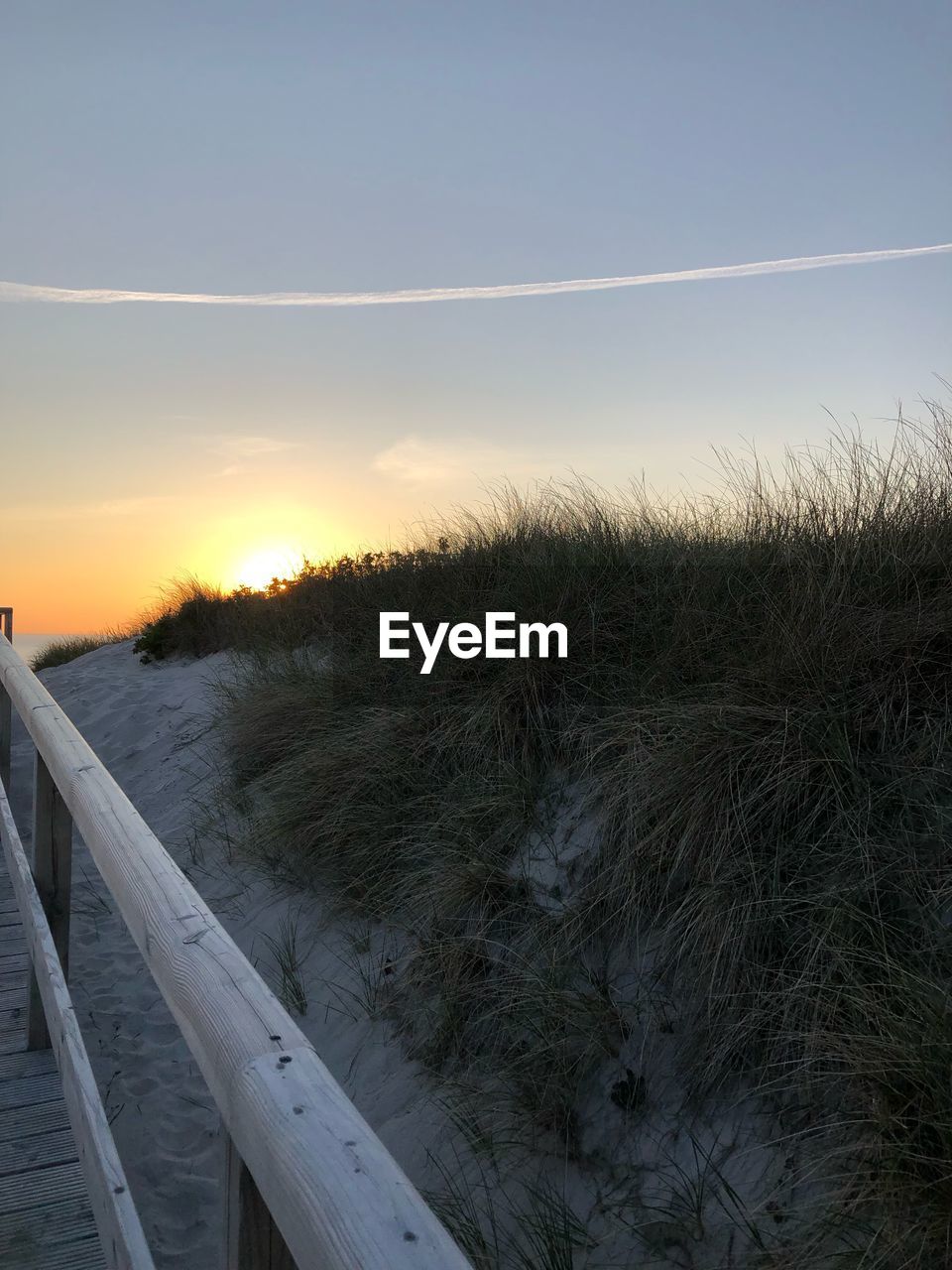 SCENIC VIEW OF BEACH DURING SUNSET