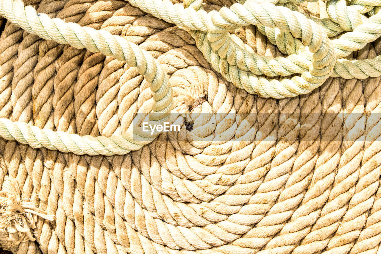 Close-up of ropes during sunny day