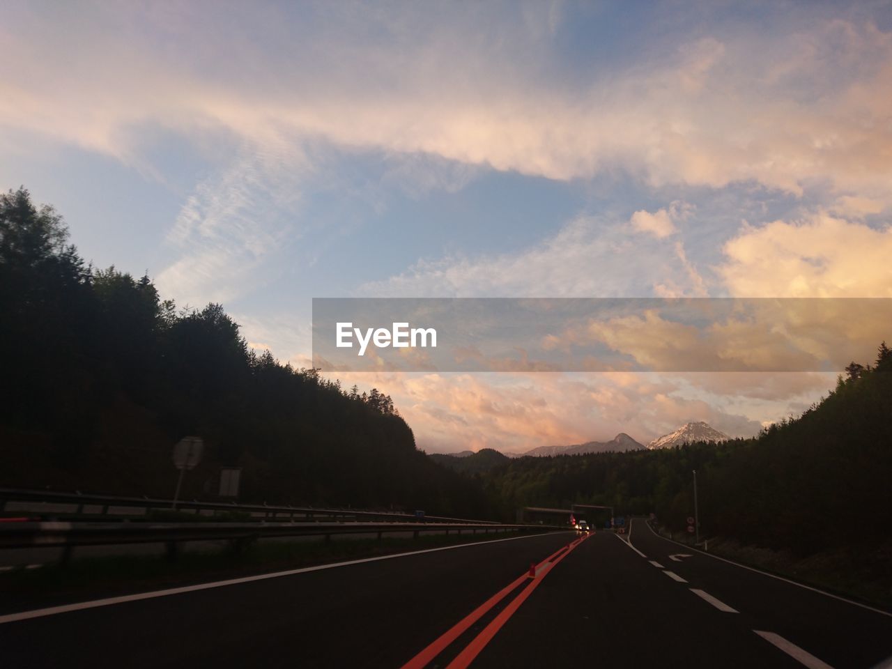 Empty road at sunset