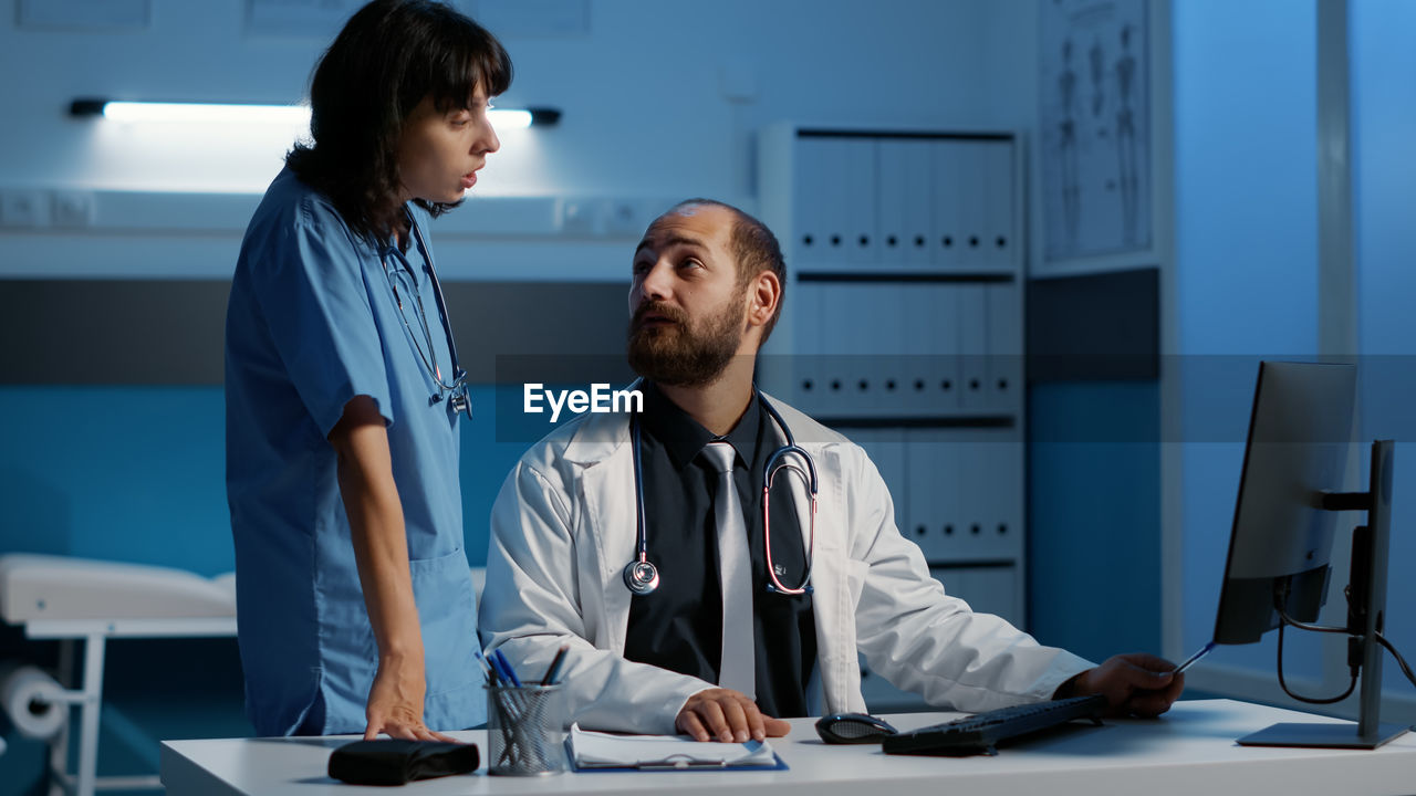 doctor examining patient in office