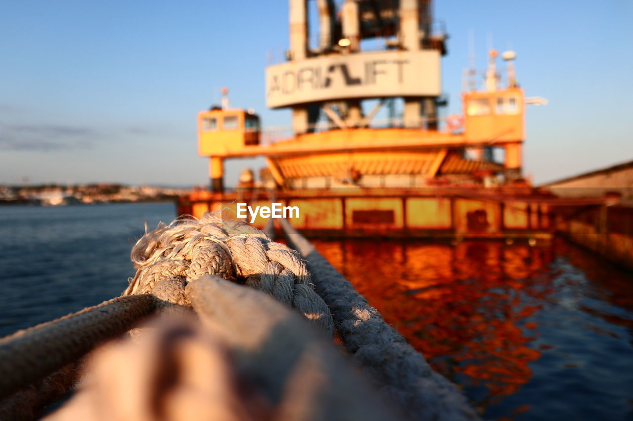 Orange ship in the commercial port of cagliari