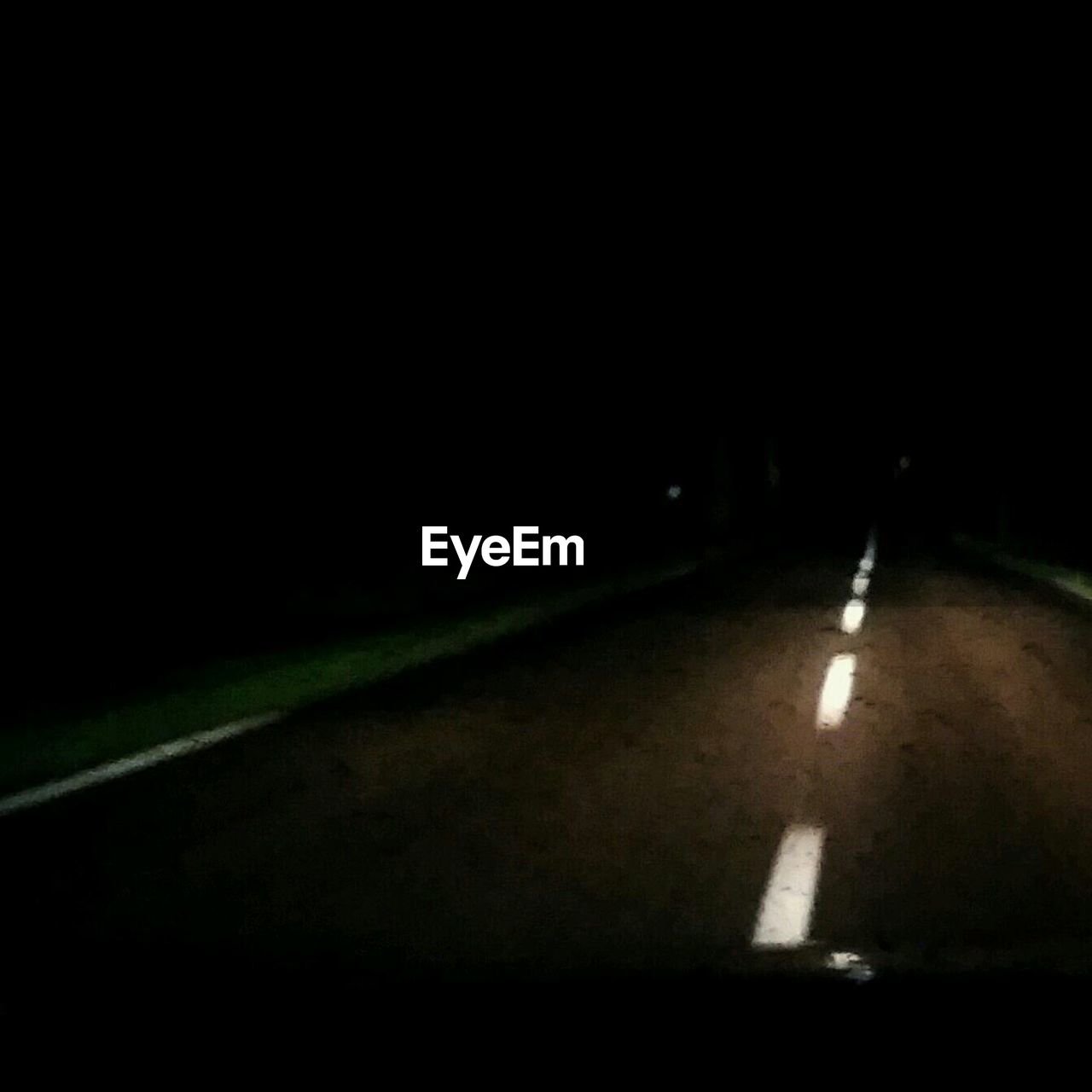 VIEW OF ROAD AT NIGHT