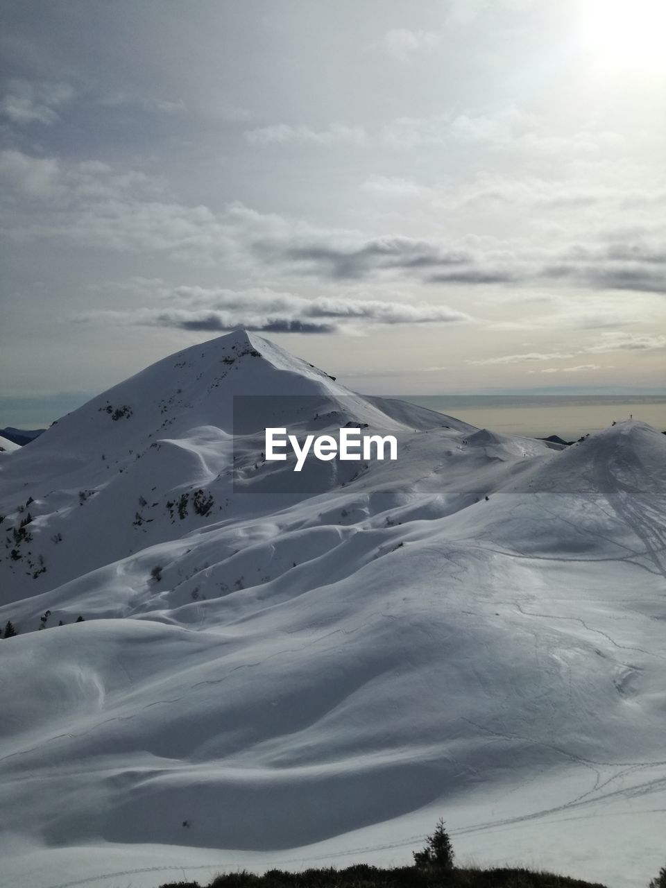 Scenic view of snowcapped mountain against sky