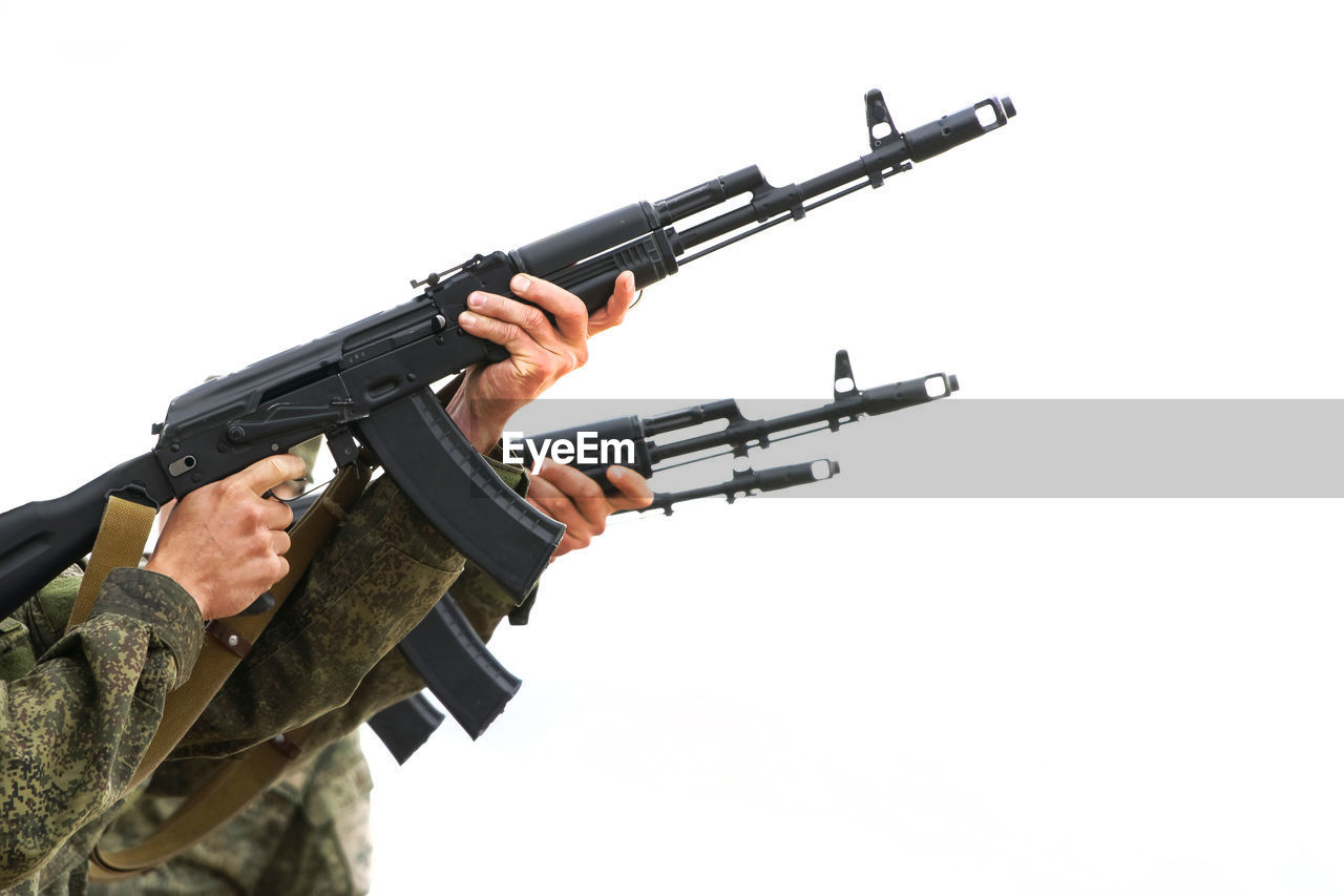 LOW ANGLE VIEW OF AIRSHOW AGAINST WHITE BACKGROUND