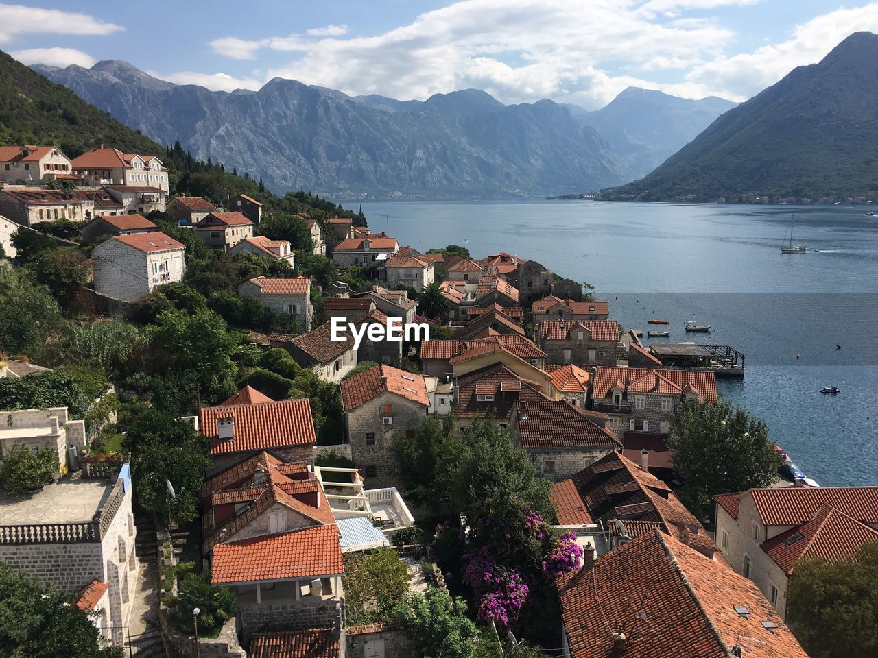 High angle view of town by river