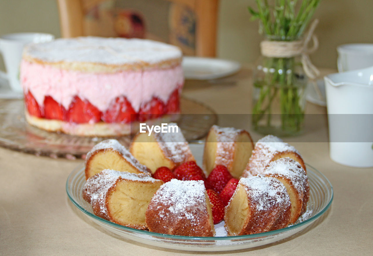 Close-up of pastries and strawberries in plate on table