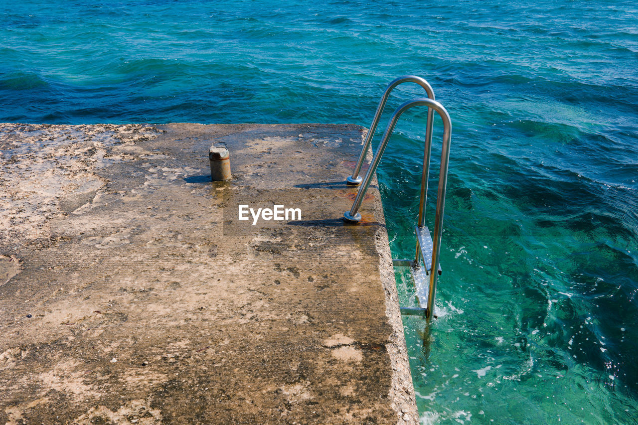 High angle view of swimming pool by sea