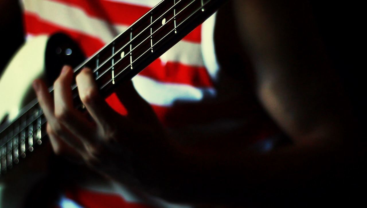 Person playing guitar at home