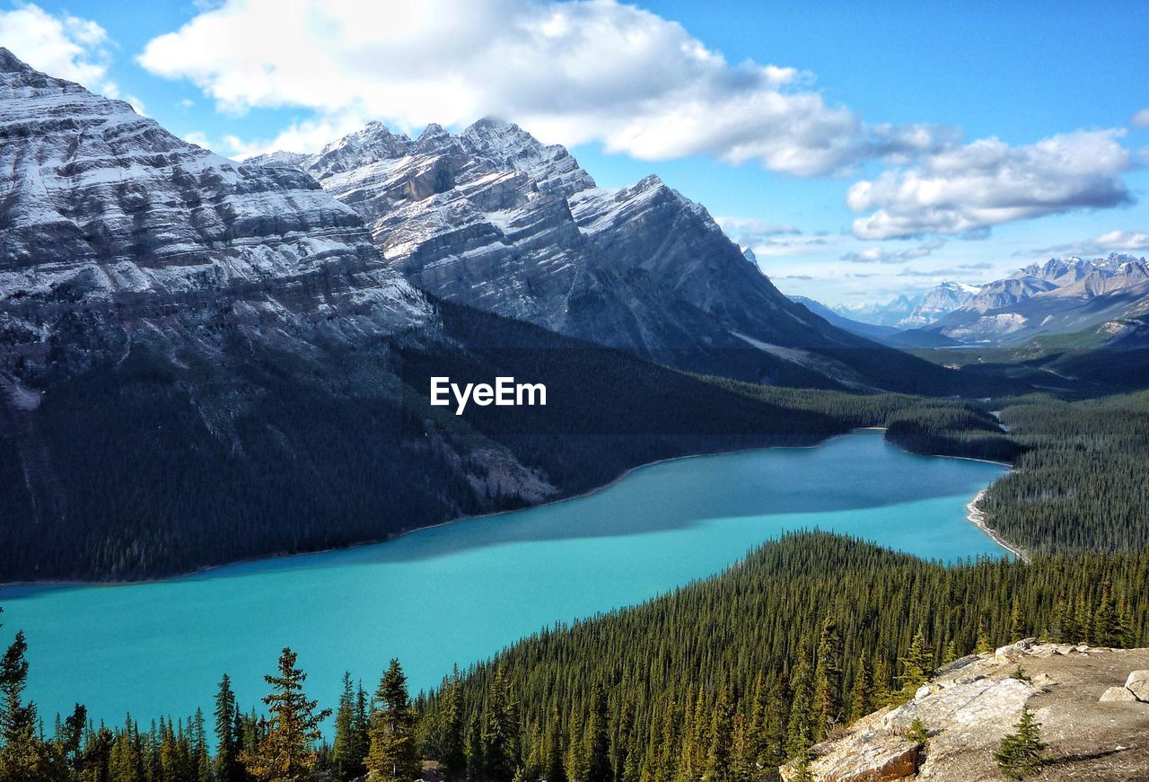 Scenic view of lake and mountains against sky