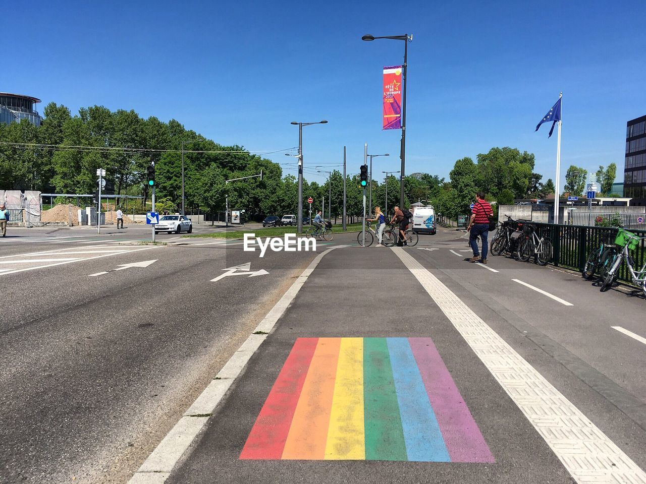 PEOPLE ON ROAD IN CITY