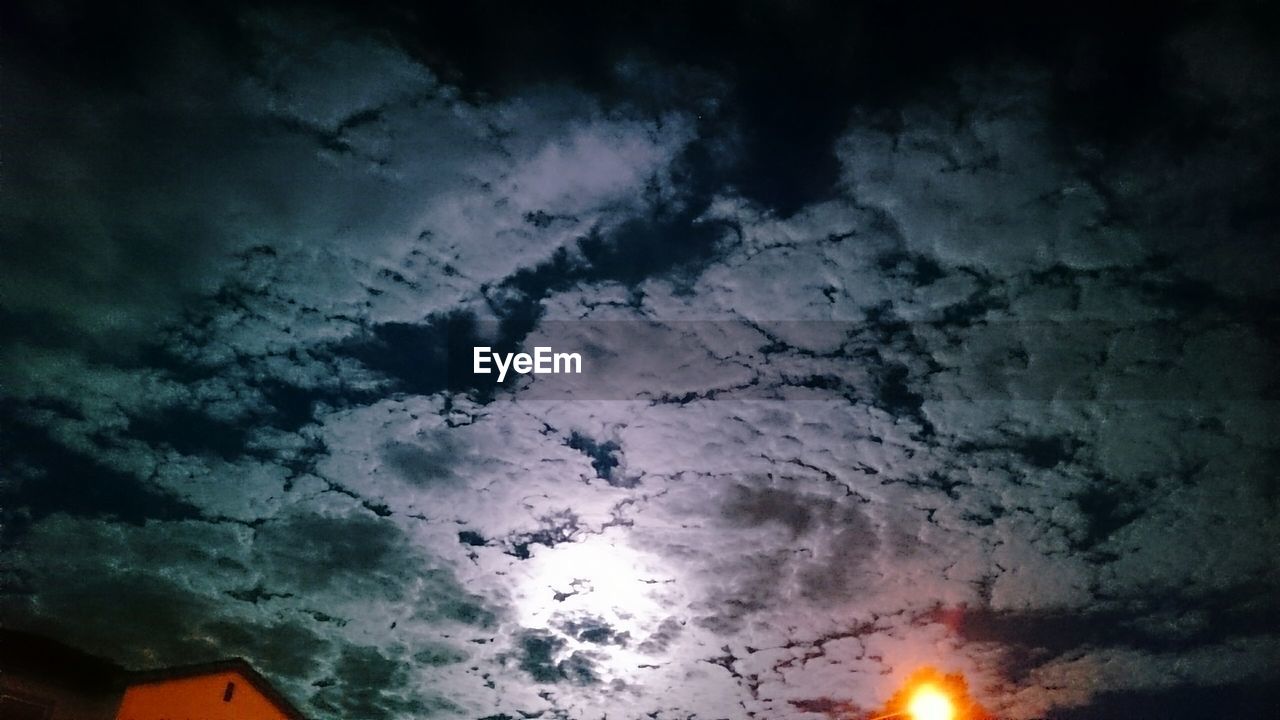 Low angle view of cloudy sky at dusk