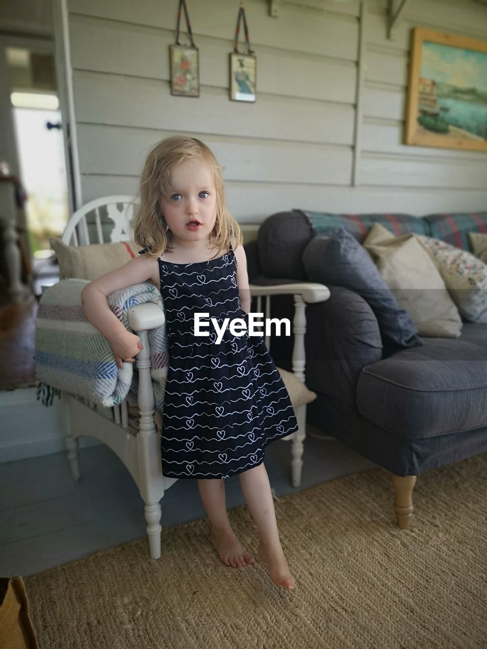 Portrait of cute girl standing at home