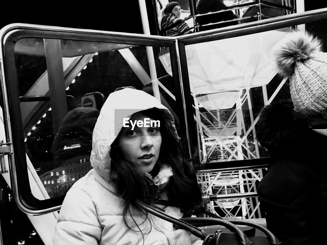 Portrait of woman sitting in carousel