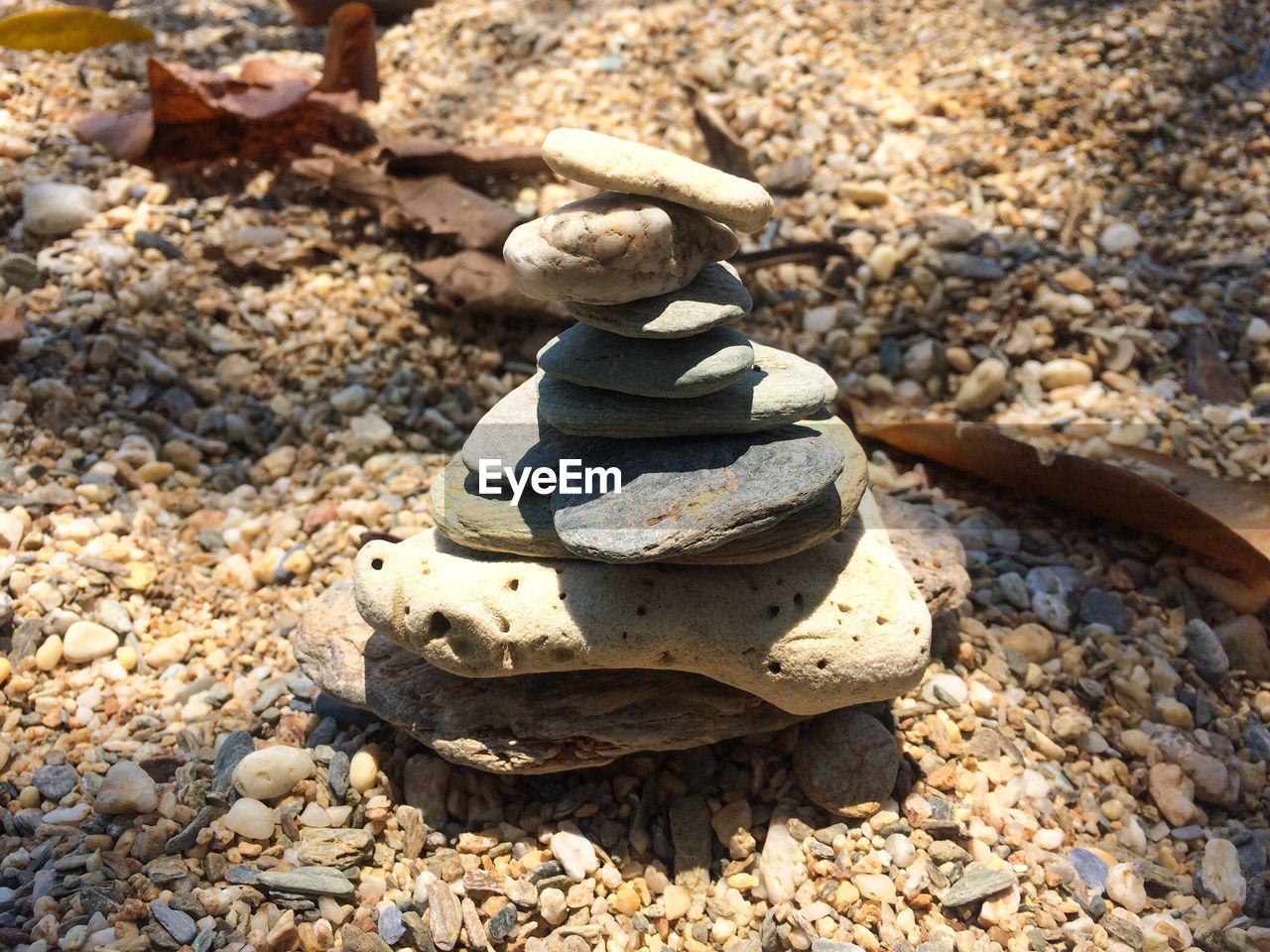 High angle view of stone stack on rocks at beach