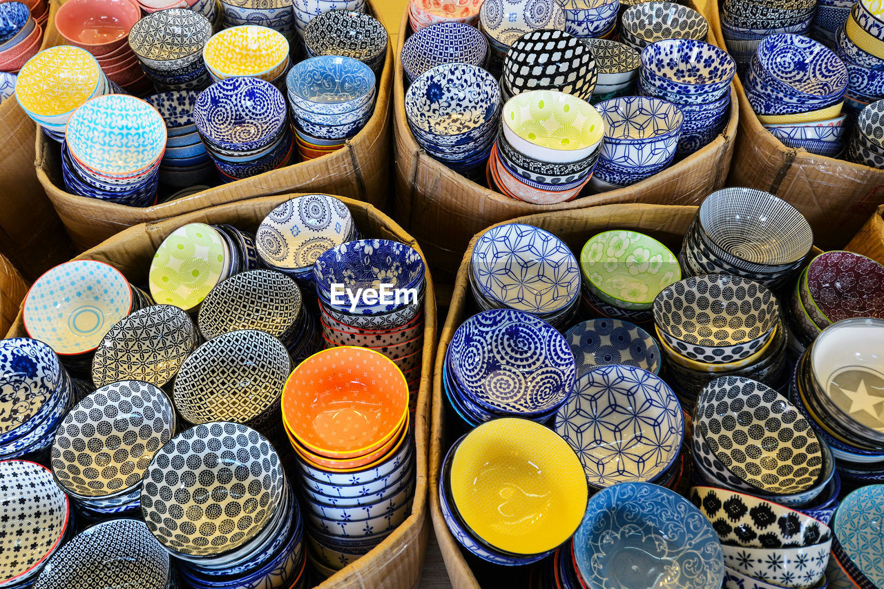 High angle view of various bowls in cardboard boxes