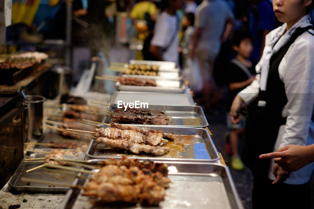 Close-up of food in trays at market stall