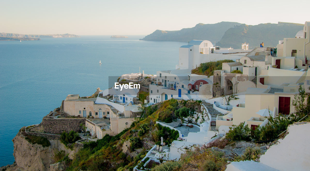 High angle shot of built structures against calm sea