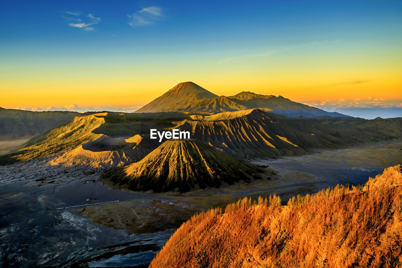 Scenic view of mountains against sky during sunset