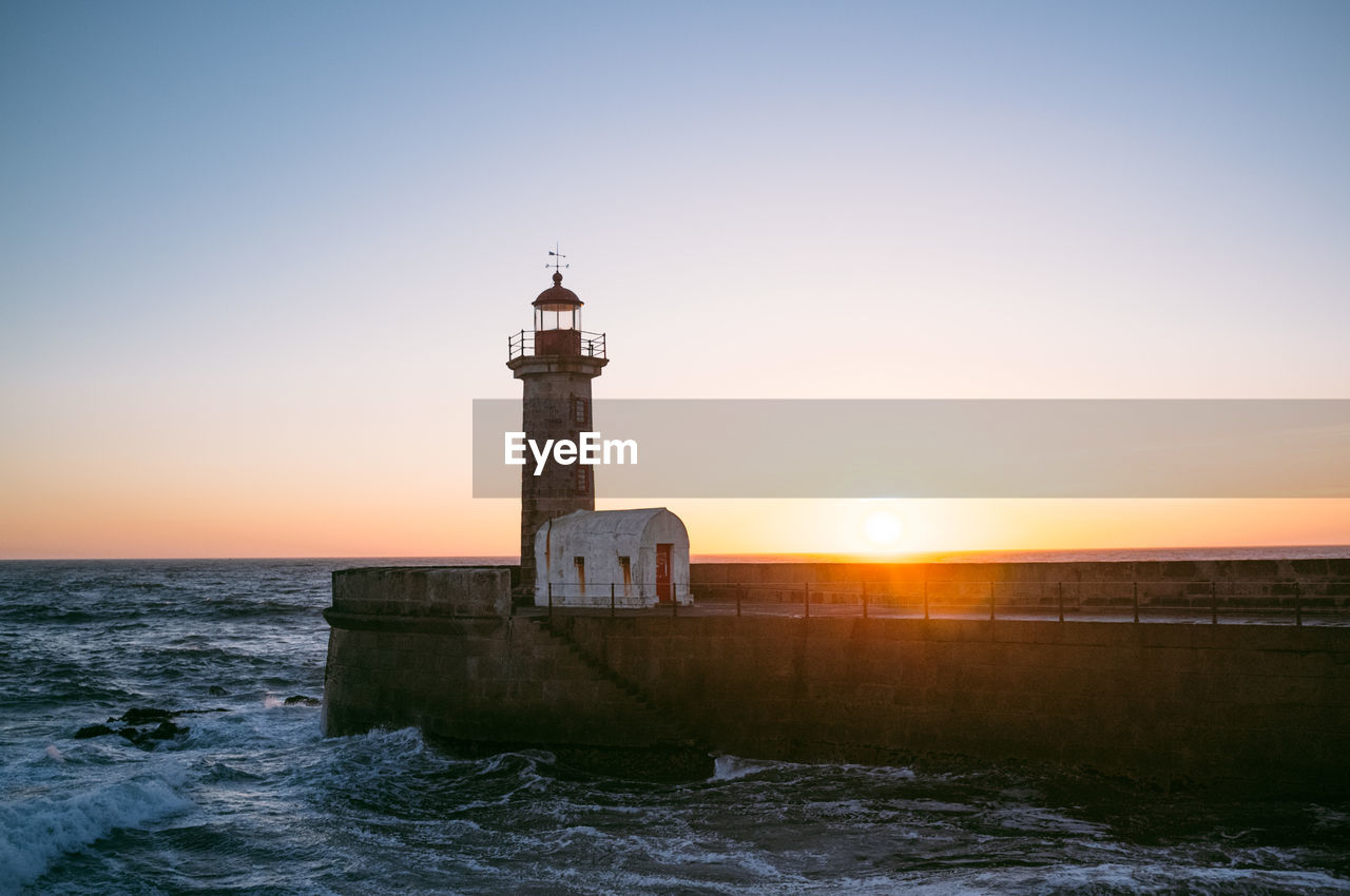 Scenic view of lighthouse on pier