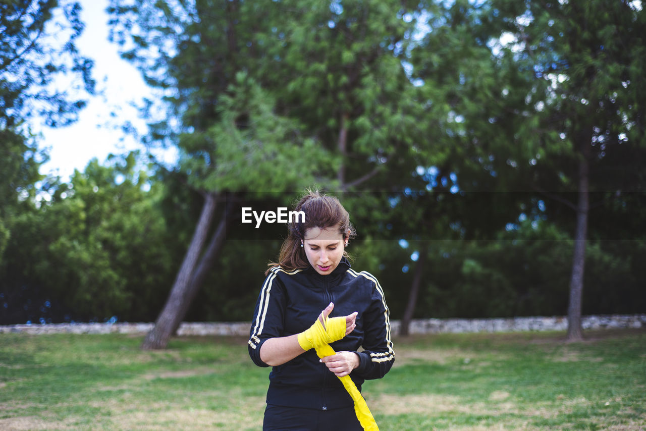 Portrait of smiling girl standing on field