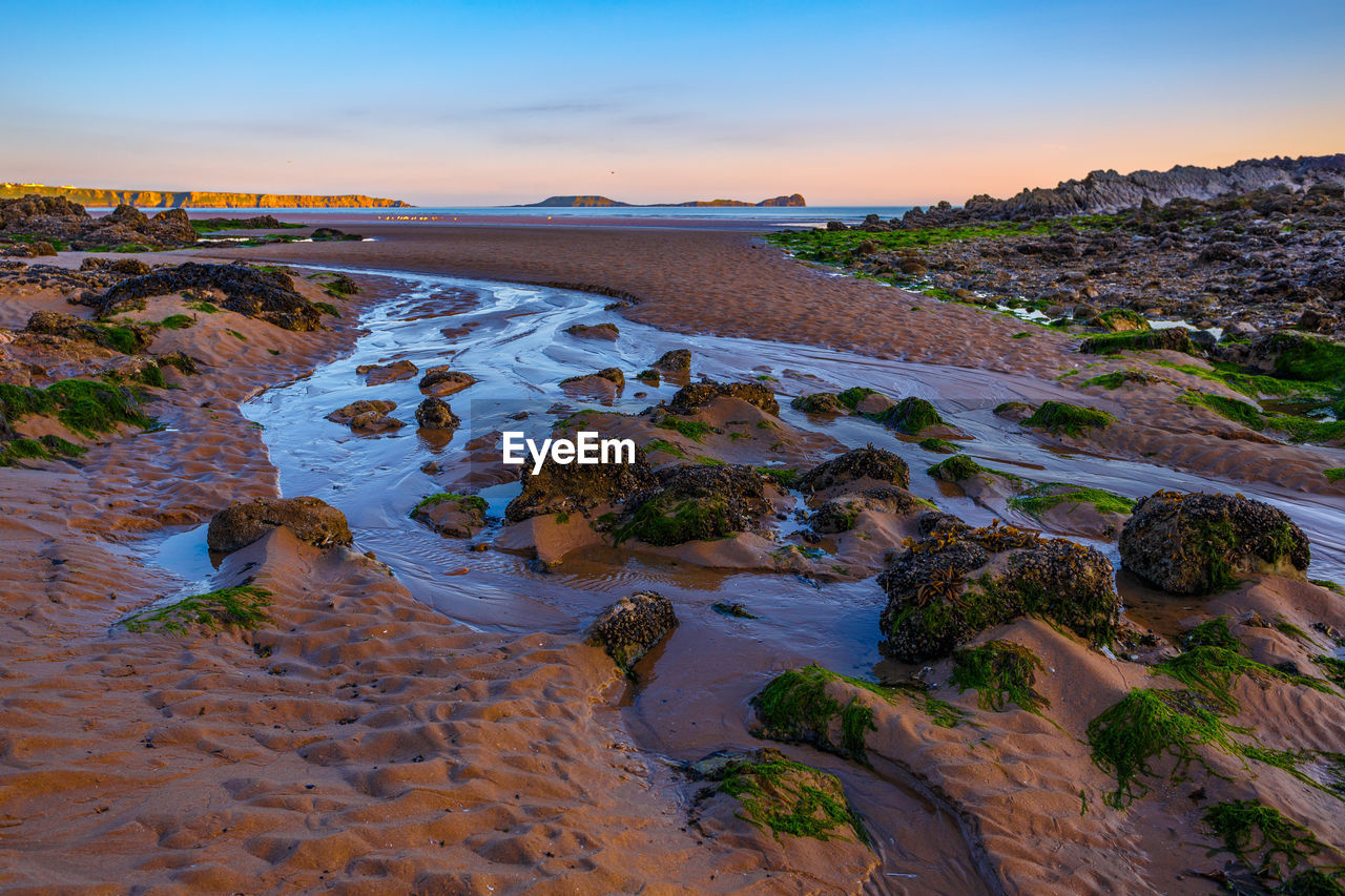 Rocky beach at sunset