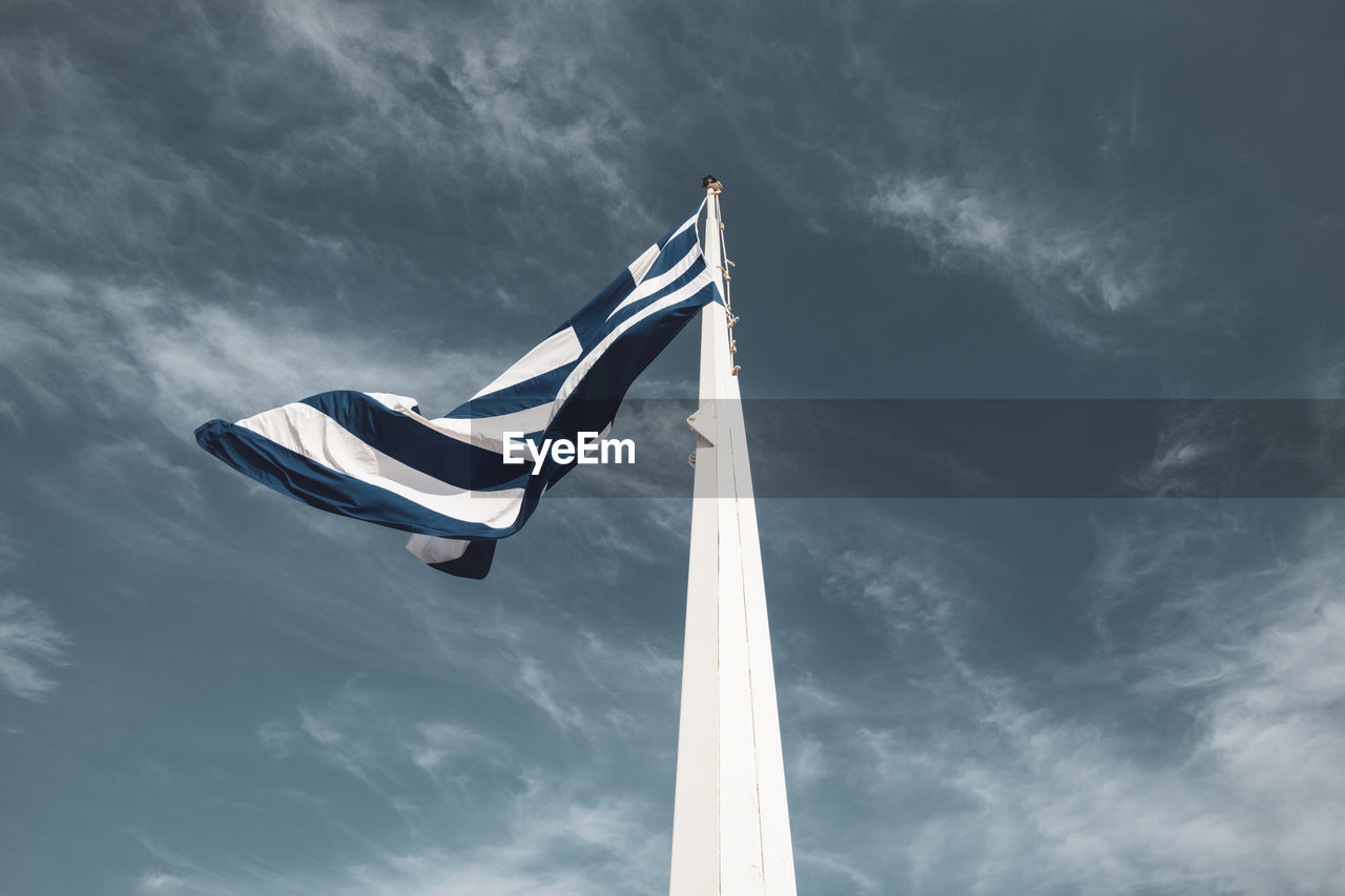 Low angle view of flag against the sky