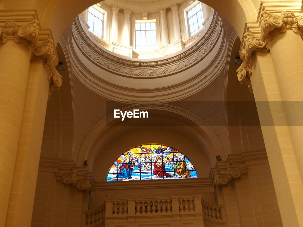 A stained glass window of a catholic church - gozo island malta