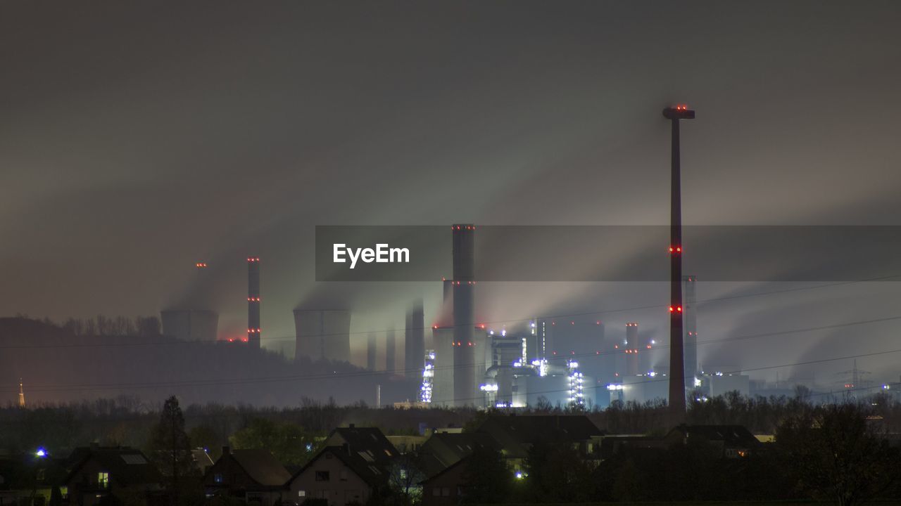 Industrial buildings lit up at night
