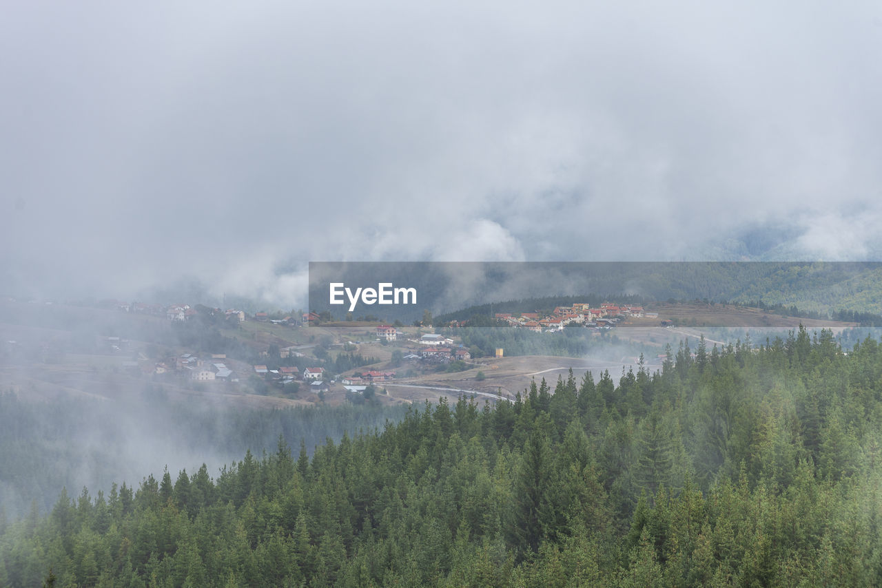 Panoramic view of mountains against sky during foggy weather