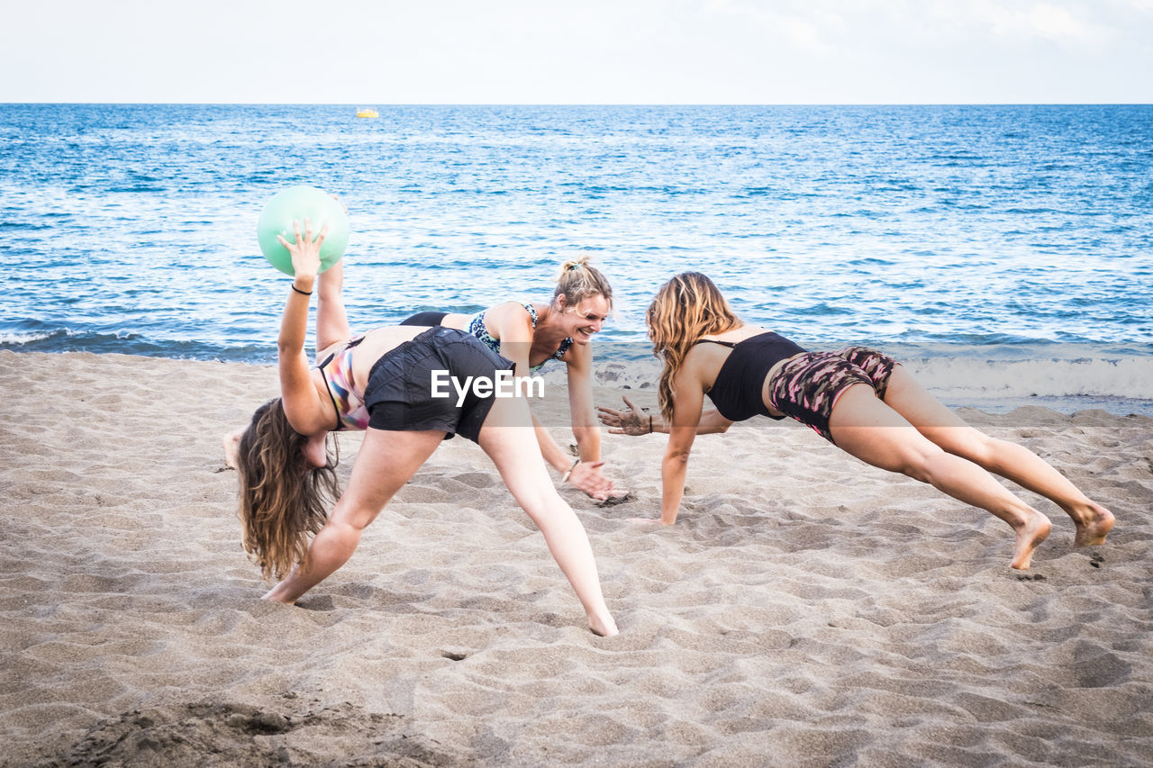Females exercising on sand